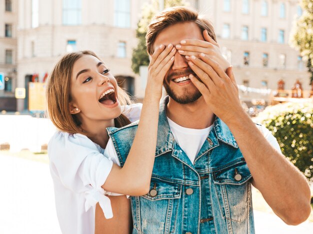 Smiling beautiful girl and her handsome hipster boyfriend.