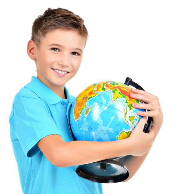 Smiling boy in casual holding globe in hands isolated on white