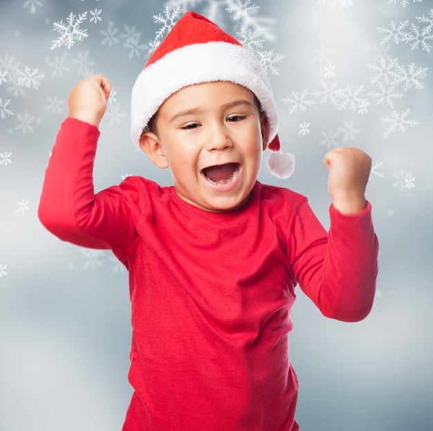 Free photo smiling boy celebrating his success