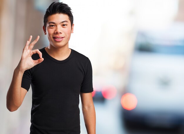 Smiling boy with approval gesture