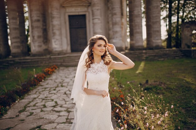 Free photo smiling bride touching her hair