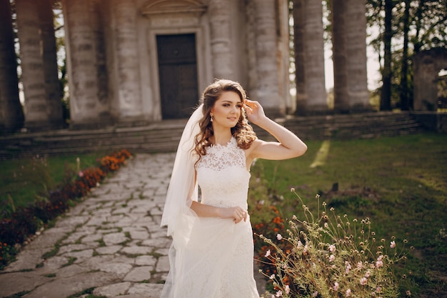 Smiling bride touching her hair