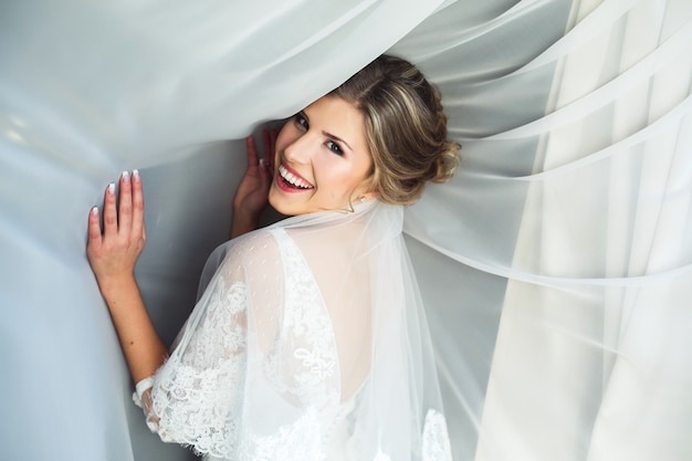 Smiling bride in veil