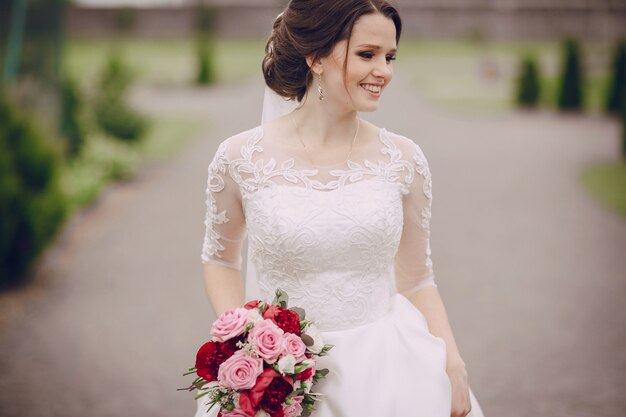 Smiling bride with her bouquet