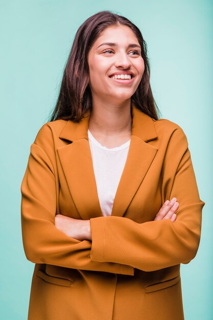 Smiling brunette girl posing with coat