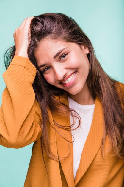 Smiling brunette girl posing with coat