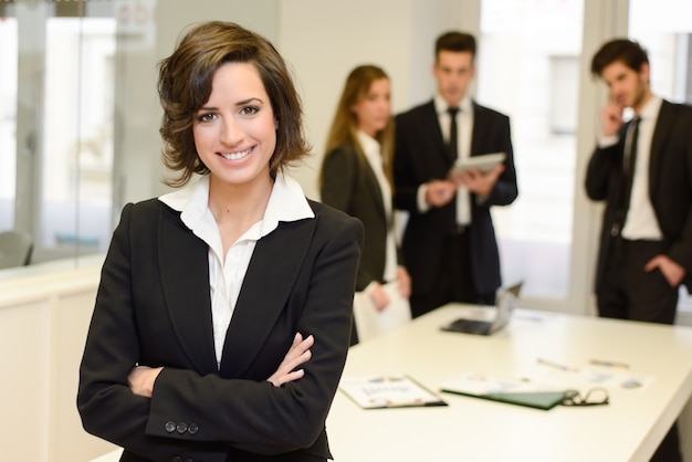 Smiling brunette manager with crossed arms