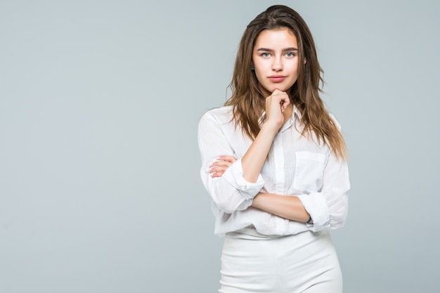 Smiling business woman hands on chin standing think looking up, businesswoman pensive smile isolated over white background