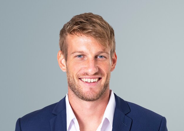 Smiling businessman face portrait, wearing suit