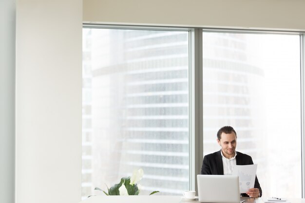 Smiling businessman in office