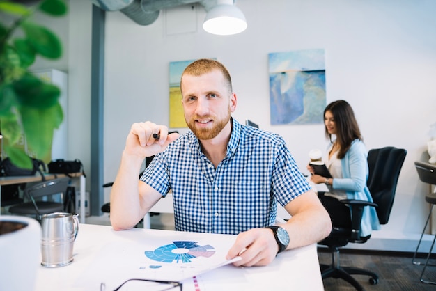 Smiling businessman in office