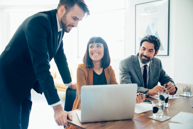 Smiling businesswoman looking at her fellow