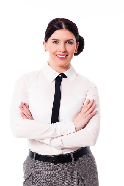 Smiling businesswoman with arms crossed