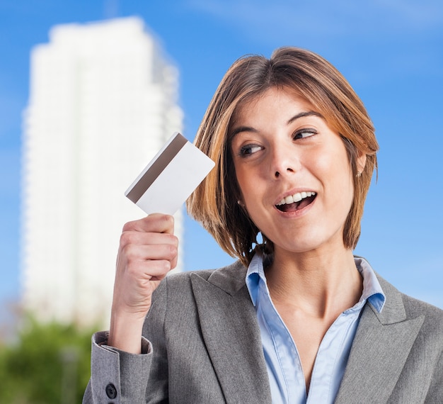 Smiling businesswoman with credit card