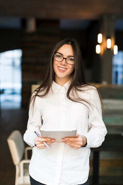 Smiling businesswoman with digital tablet