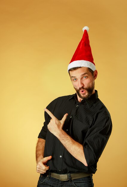 Smiling christmas man wearing a santa hat