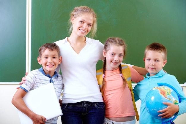 Smiling classmates with the teacher