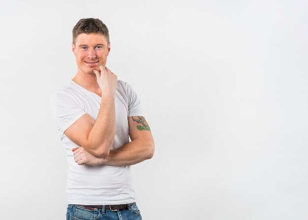 Smiling confident young man isolated on white background