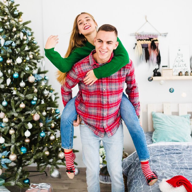 Smiling couple celebrating christmas together