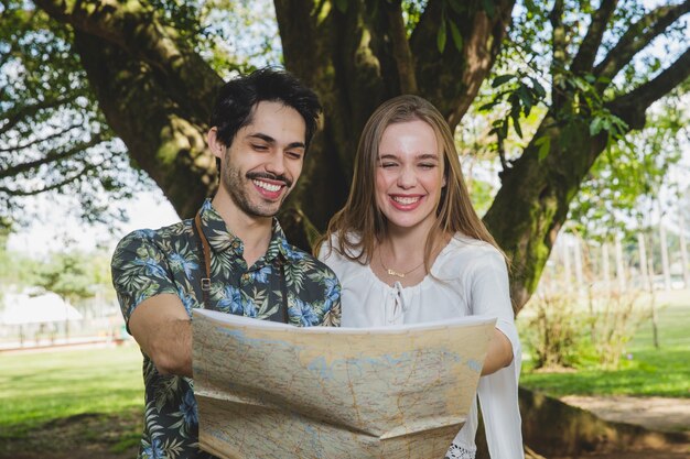 Smiling couple looking at map