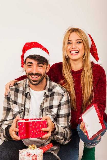 Smiling couple receiving presents
