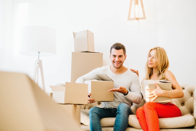 Smiling couple while relocating