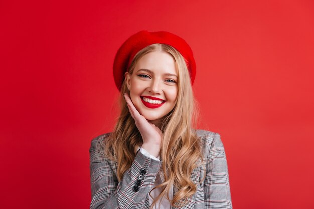 smiling cute blonde woman. Gorgeous girl in beret expressing happiness.