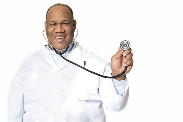 Smiling doctor against a white surface