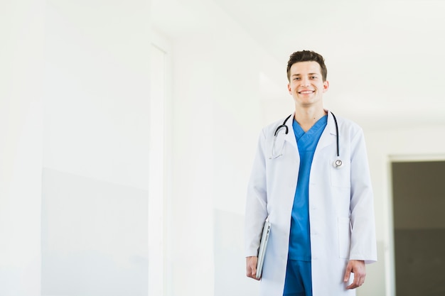 Smiling doctor with clipboard