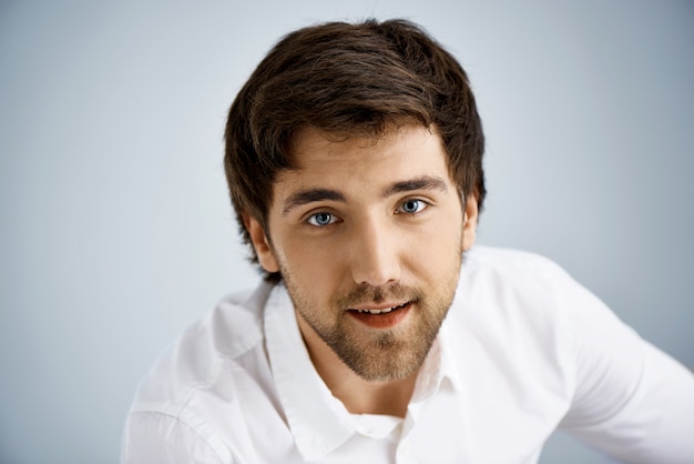 Smiling elegant man in white shirt