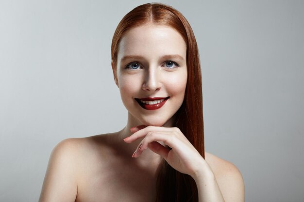 Smiling elegant redhead woman