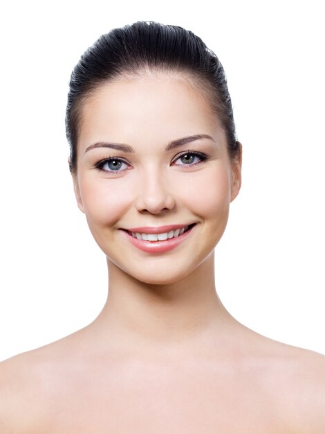 Smiling face of woman with healthy clean skin