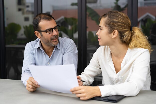 Smiling female client consulting male expert