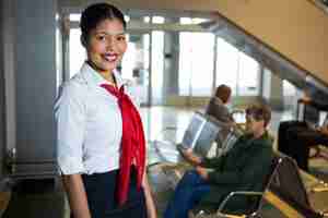 Free photo smiling female staff standing