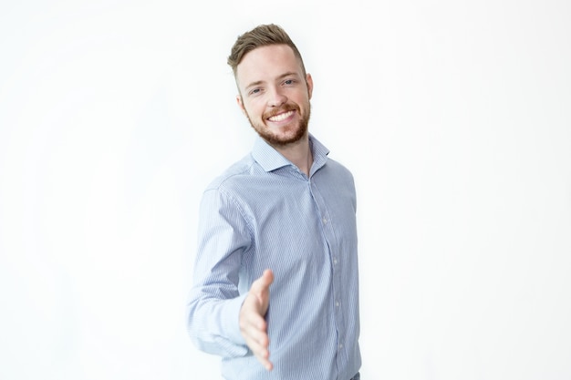 Smiling Friendly Man Extending Arm for Handshake