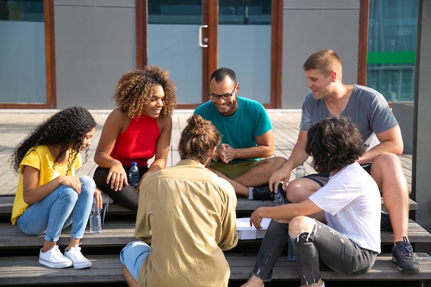 Smiling friends spending time outdoors