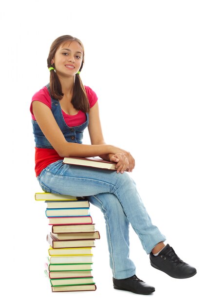 Smiling girl enjoying with books