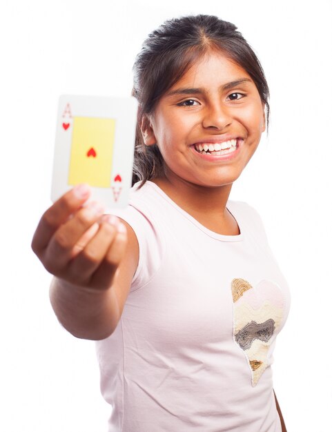 Smiling girl holding a poker card