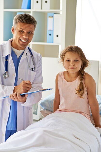 Smiling girl in hospital bed