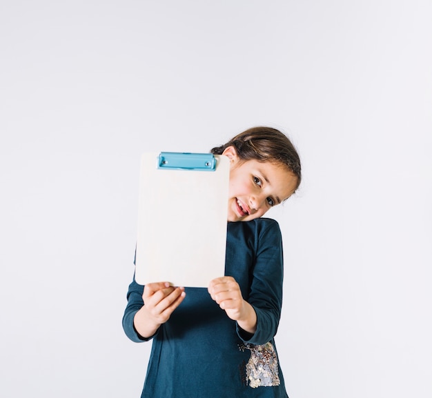 Smiling girl showing clipboard