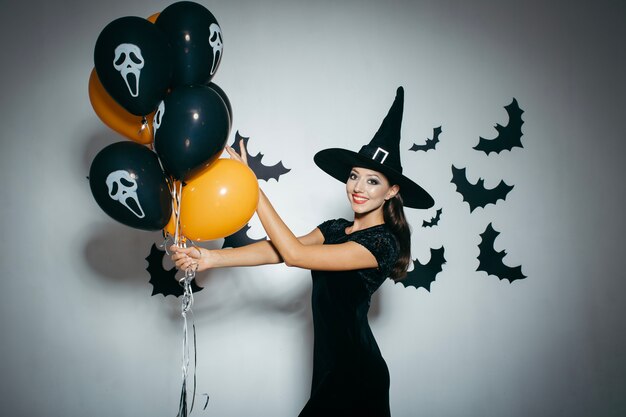 Smiling girl with balloons decorations