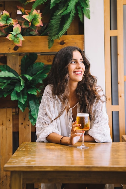 Smiling girl with beer