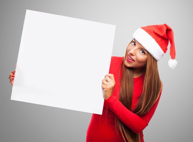 Smiling girl with a blank signboard for a message