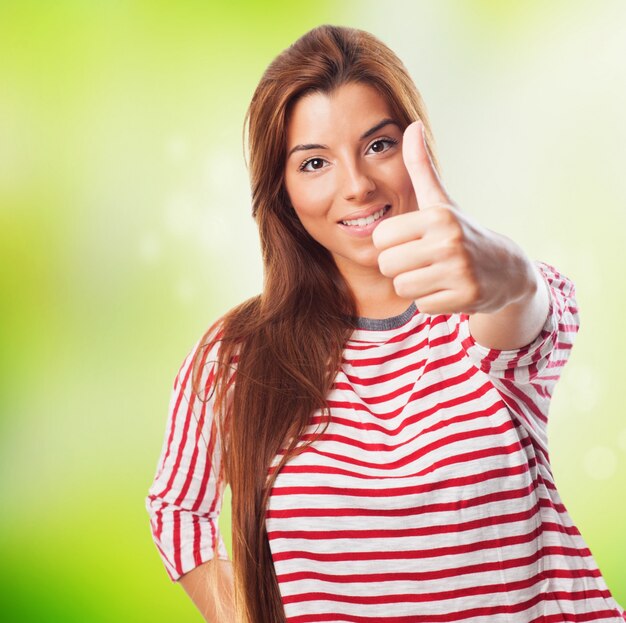 Smiling girl with thumb up