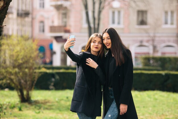 Smiling girls taking a photo