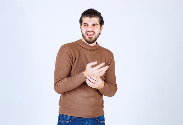 smiling good looking man model standing and looking away.