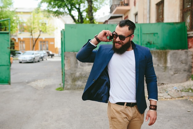 Smiling guy talking on the phone