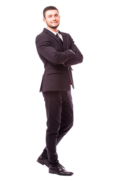 Smiling handsome businessman. Isolated over white wall
