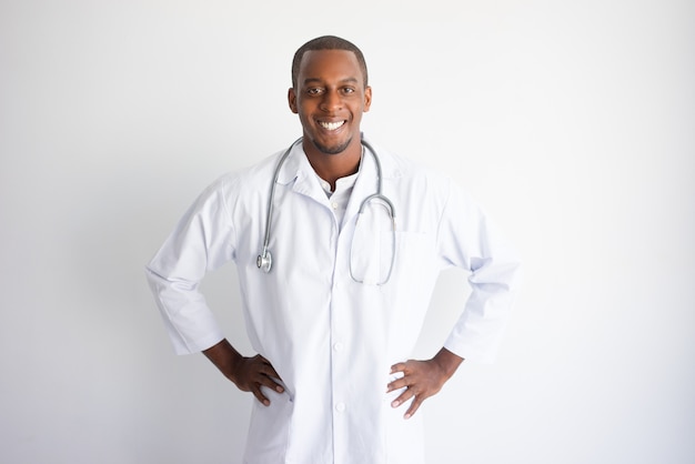 Smiling handsome young black male doctor. Medicine concept. 