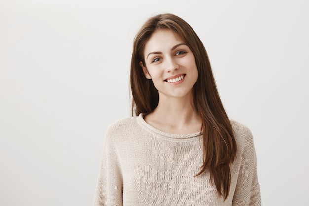 Smiling happy caucasian girl looking friendly